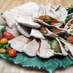 Hummus, Cucumbers, Tomatoes, Red Onion and Pomegranate Molasses in Pita Pockets