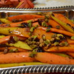 Carrots with Orange Glaze, Za’atar Spices, Cranberries and Pistashios